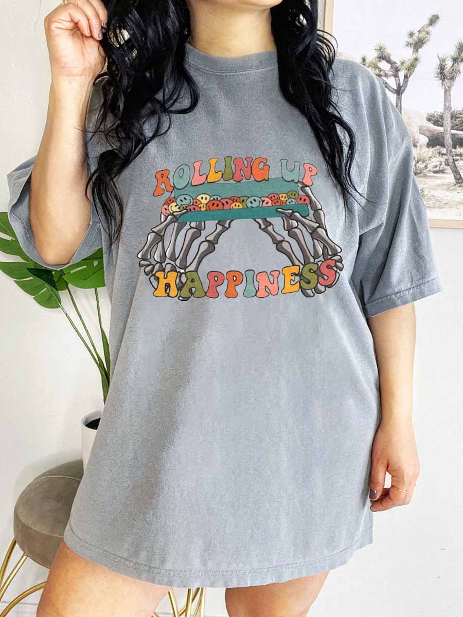 Rolling up Happiness skeleton hands tee