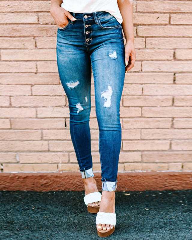 Pantalones vaqueros ajustados rasgados de mujer con botones lavados aj