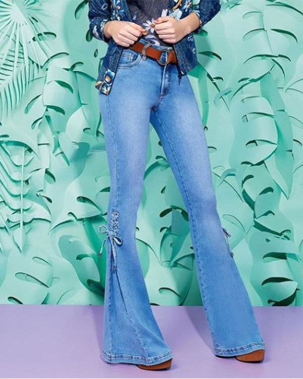 Pantalones de mezclilla de tiro medio con lazo jeans elásticos pantalo