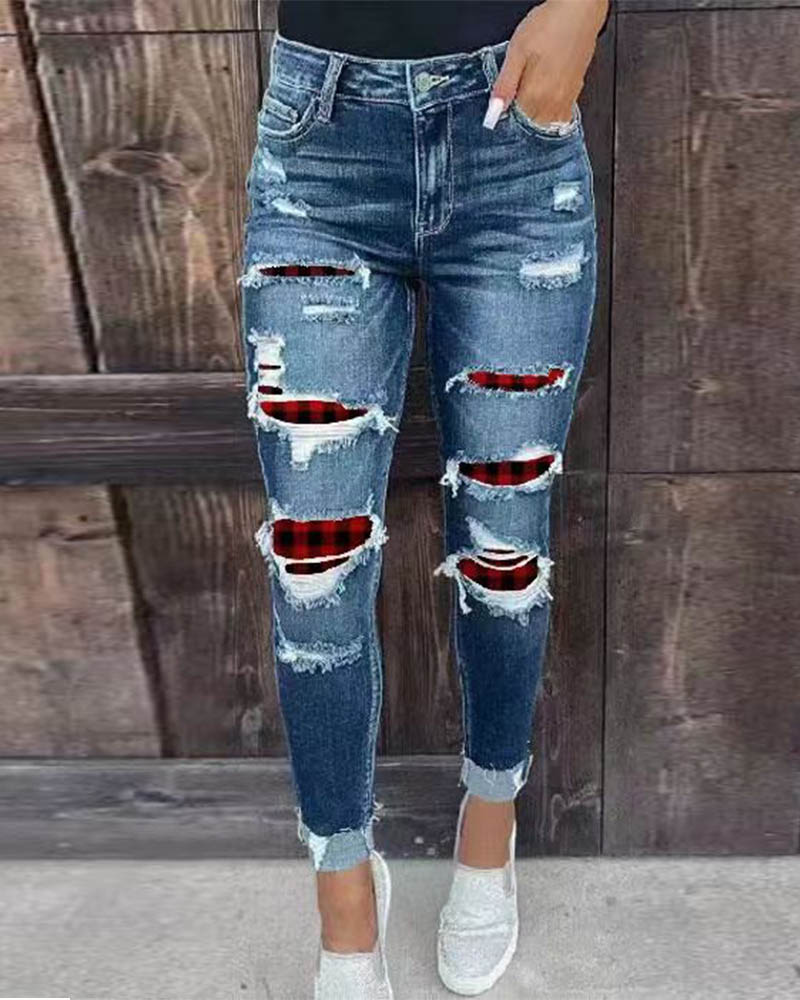 Pantalones de mezclilla rasgados elásticos Jeans ajustados de moda con