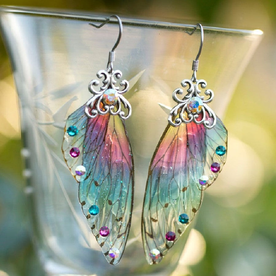 Brincos de diamantes coloridos com asas em gradiente