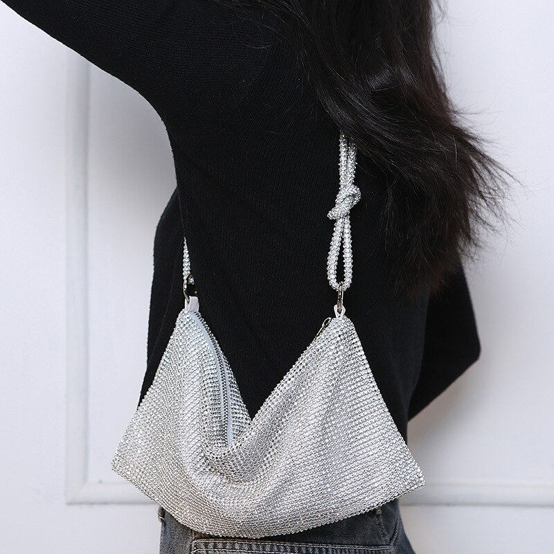 black bag with chunky gold chain