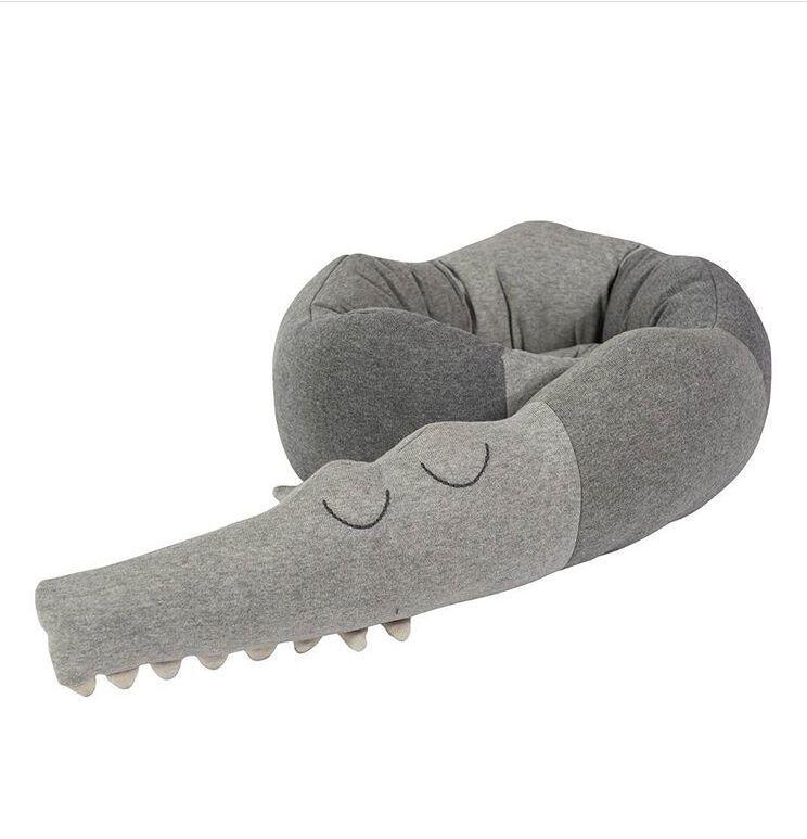 Children's crocodile bed toy.