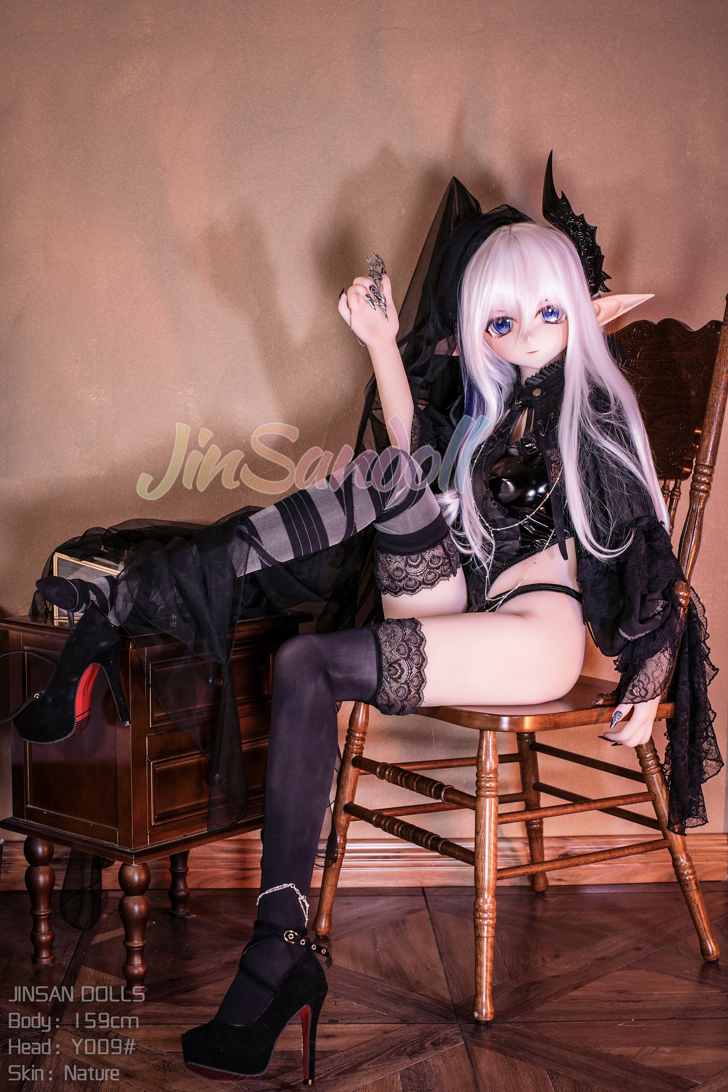Elita sex doll with white hair, fantasy style, sitting on a chair