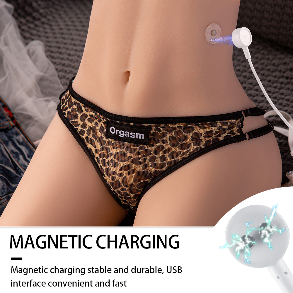 Sex doll torso wearing leopard print underwear with the word 'Orgasm,' showing magnetic charging setup connected to the navel area. Text reads 'MAGNETIC CHARGING,' describing stability, durability, and convenience of USB interface.