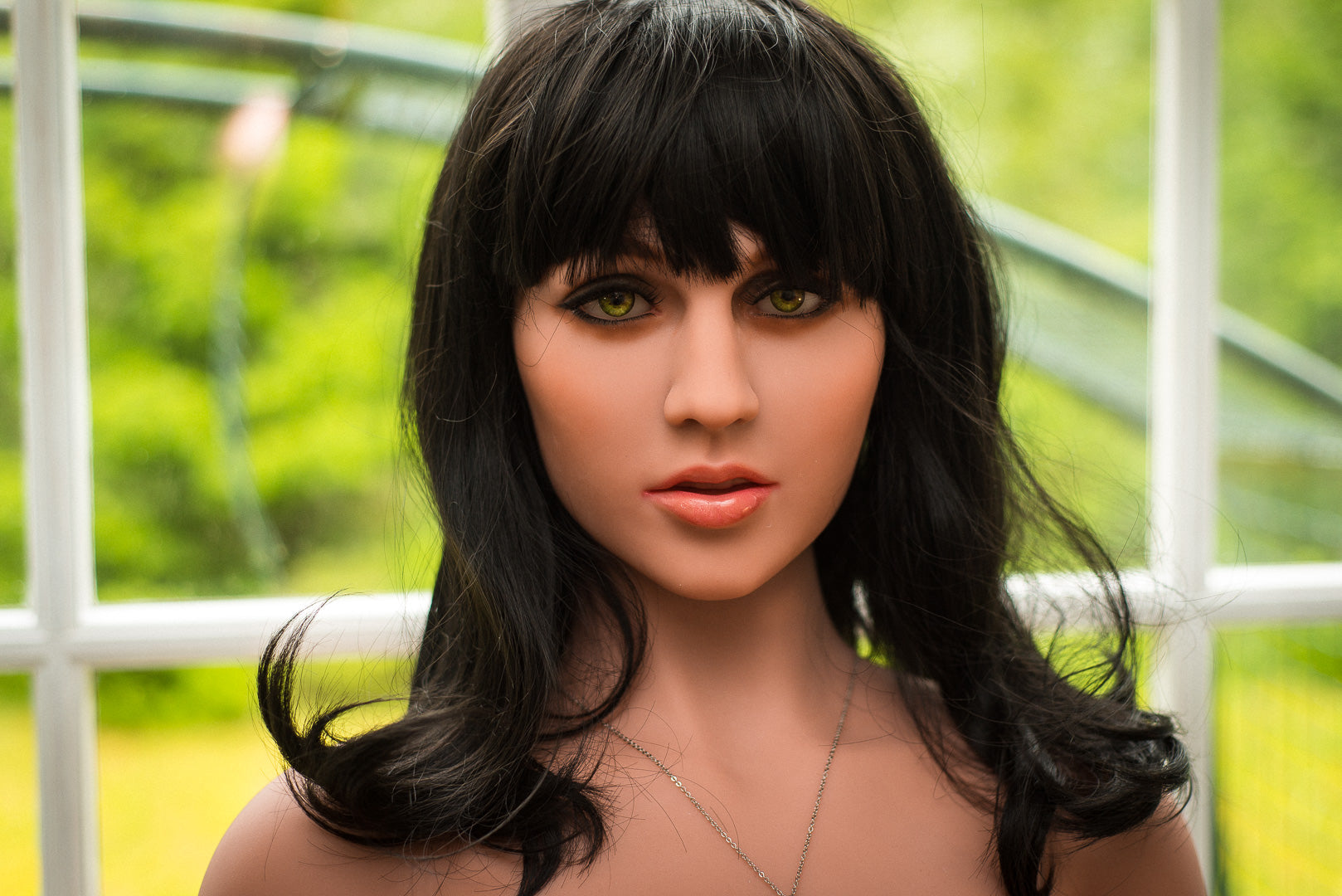 Denise sex doll, close-up, green eyes, black hair
