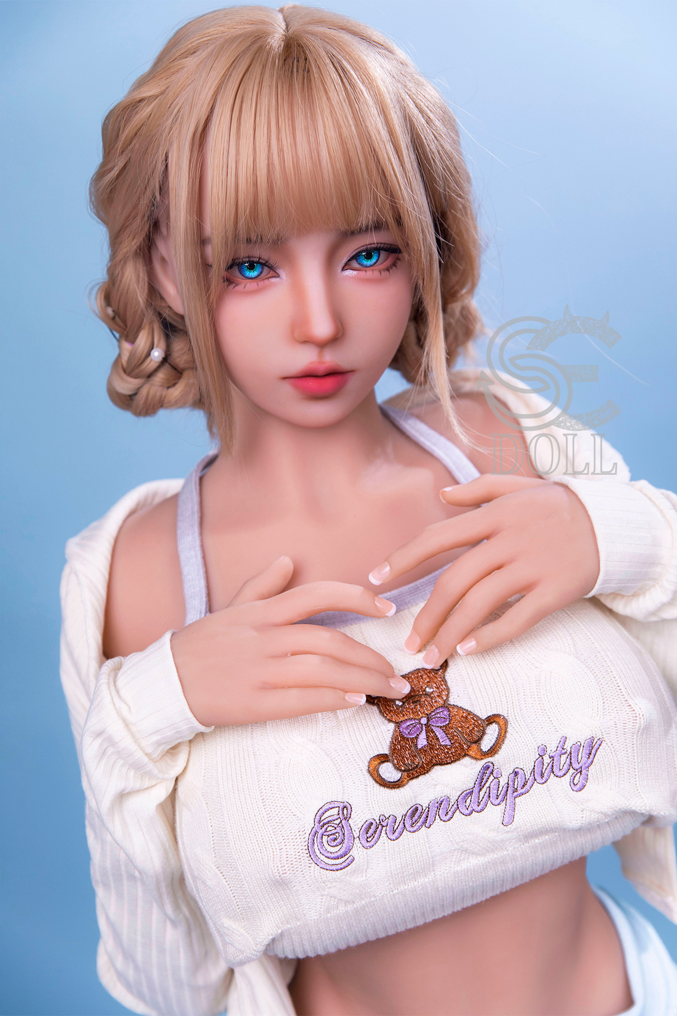 Melody sex doll with blue eyes, wearing a sweater with Serendipity on it