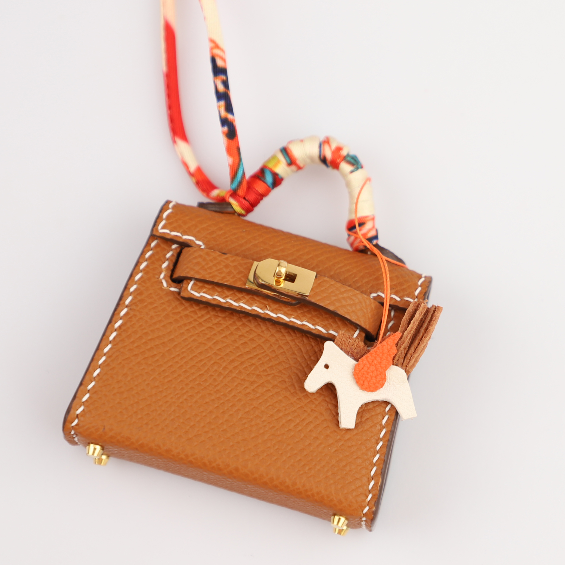 Hermès Kelly Twilly Bag Charm With Printed Silk Strap in Red