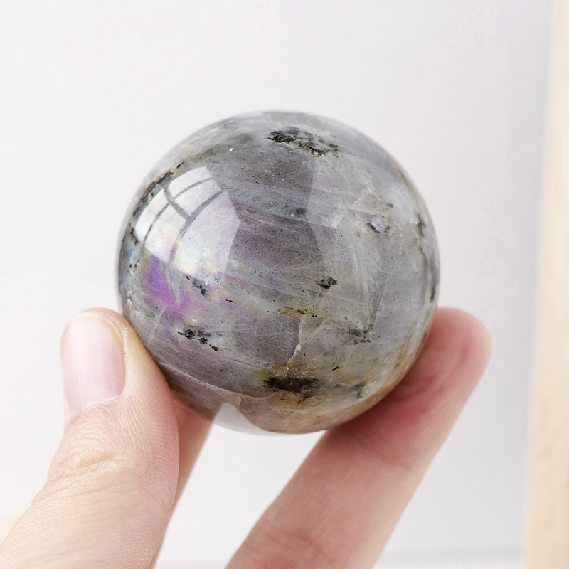 Natural crystal purple light elongated stone ball