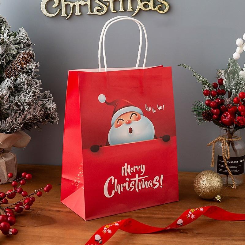 Sacchetto di carta regalo di Natale con manici per forniture per feste della vigilia di Natale
