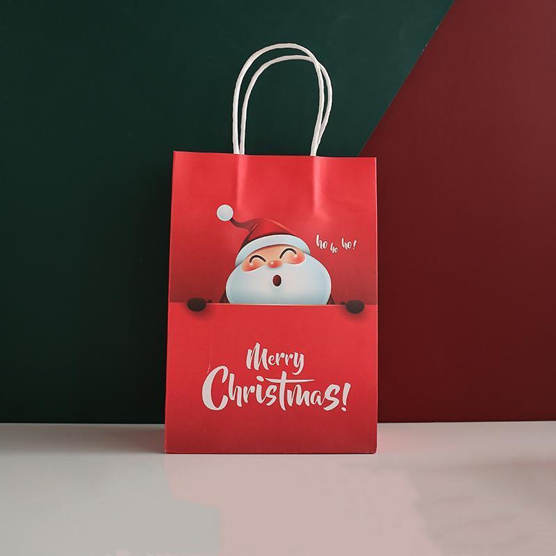 Sacchetto di carta regalo di Natale con manici per forniture per feste della vigilia di Natale