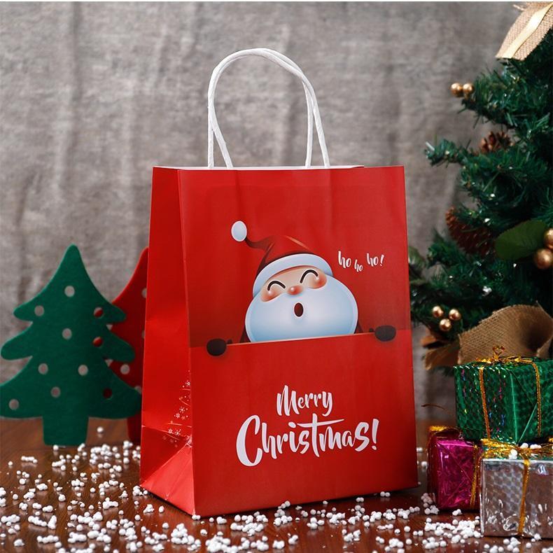 Sacchetto di carta regalo di Natale con manici per forniture per feste della vigilia di Natale