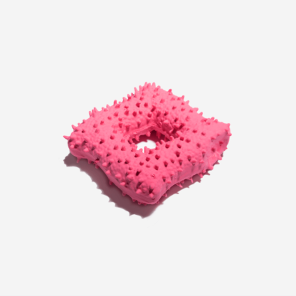 Red square shaped dog toy on the white background.