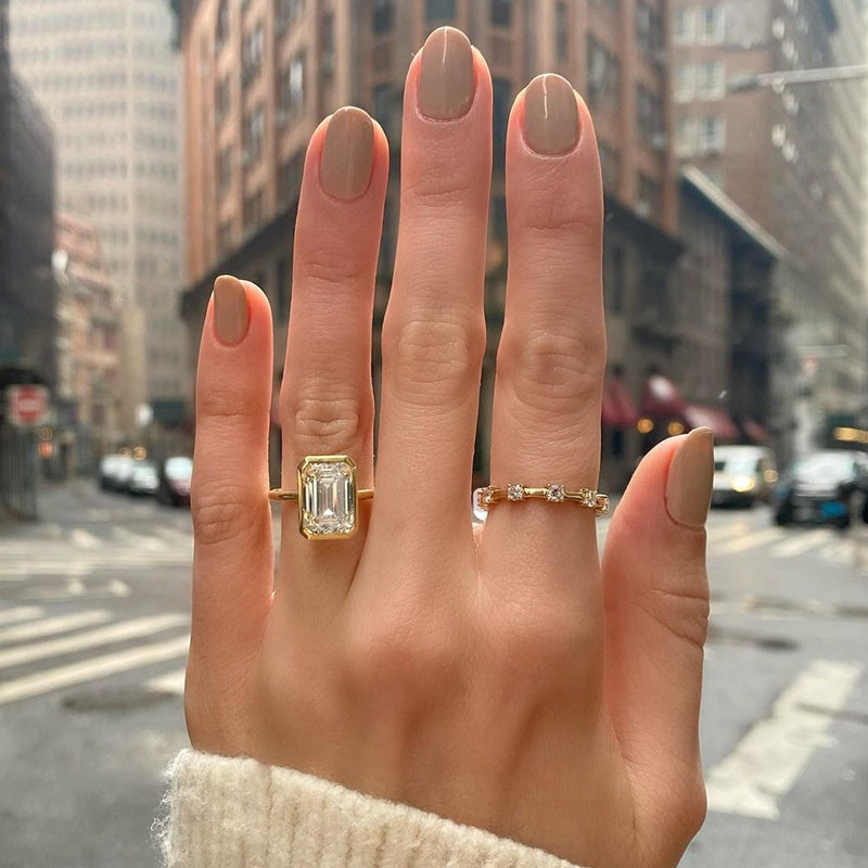 Yellow gold store emerald cut ring