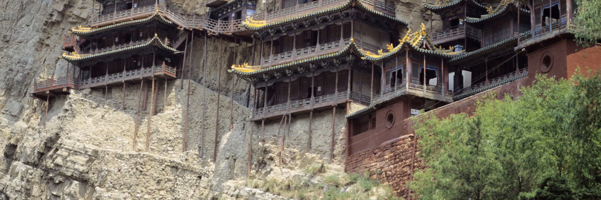 The exterior of the Hanging Temple is supported by wooden pillars