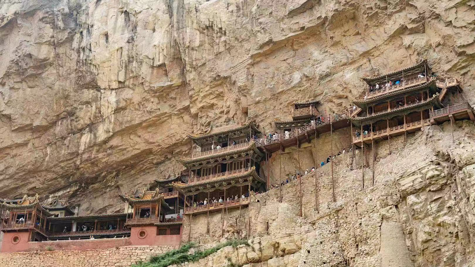 A steady stream of visitors to Hanging Temple