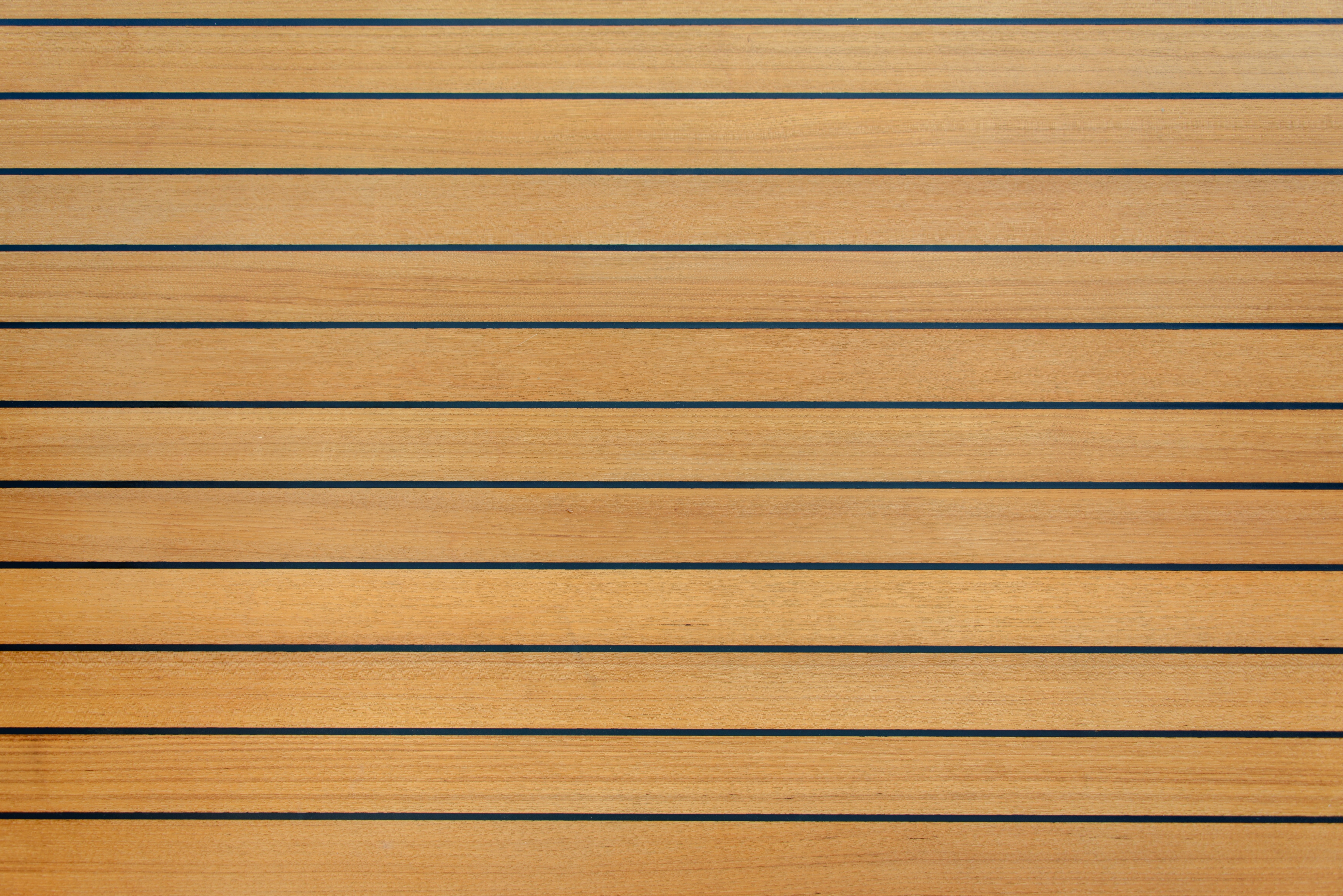 Burma teak deck surface with golden color and detailed grain