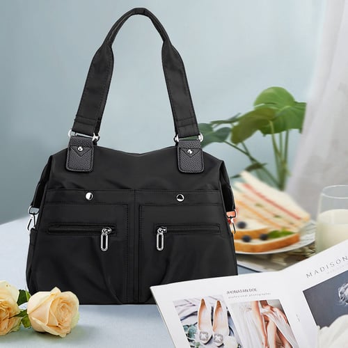 Nagy kapacitású vízálló Multi Pocket válltáska