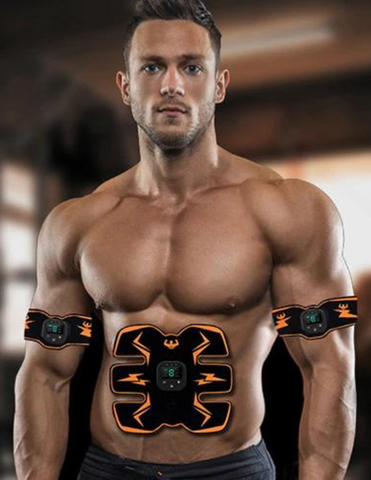 Fit man with EMS muscle stimulator