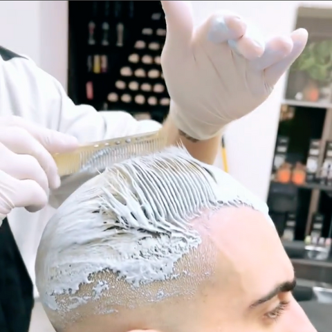 Professional hair coloring at barbershop for men