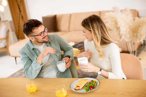 White couple having homemade dinner of bread and milk