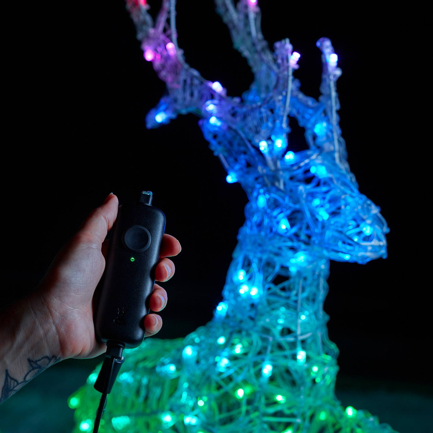 A person connecting their phone with the Twinkly device remote.