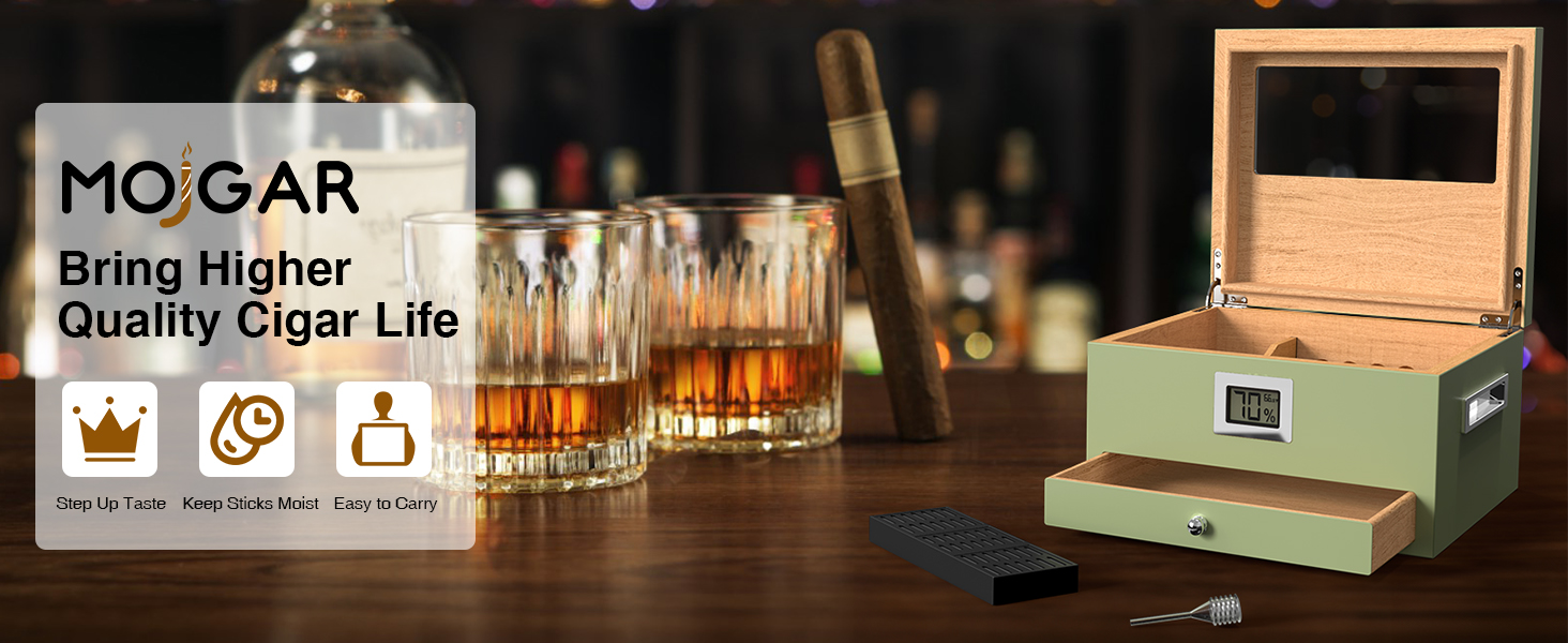 A stylish Mojgar cigar humidor with a hygrometer, alongside whiskey glasses, a cigar, and accessories, promoting a better cigar experience.