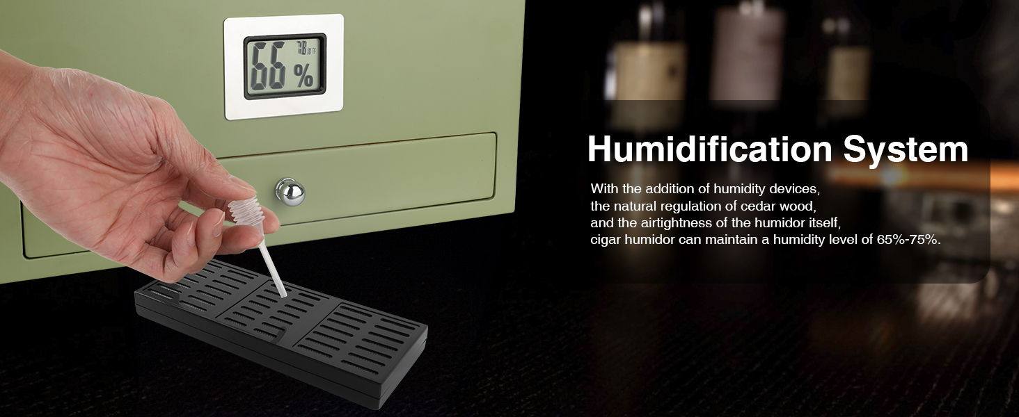 A hand adding moisture to the Mojgar cigar humidor's humidification system, ensuring optimal humidity for cigar storage, with a hygrometer displaying 66%-75%